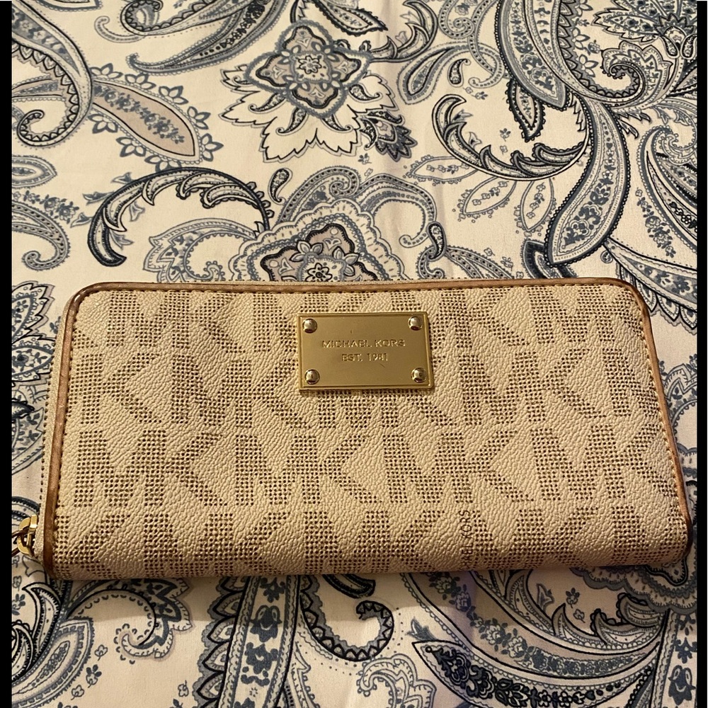 Michael Kors wallet with gold tone plate on front